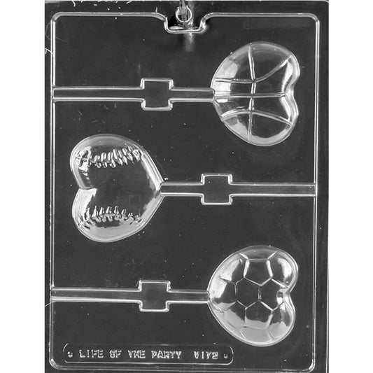 Clear plastic chocolate lollipop mold with three heart-shaped cavities featuring sports ball patterns for basketball, baseball, and soccer, each with a stick channel.