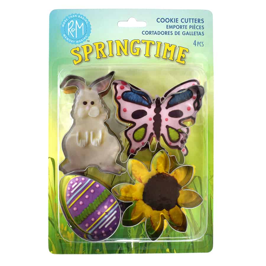 Springtime Cookie Cutter Set in packaging, featuring a bunny, butterfly, daisy, and egg-shaped cookie cutters on a green, spring-themed background.