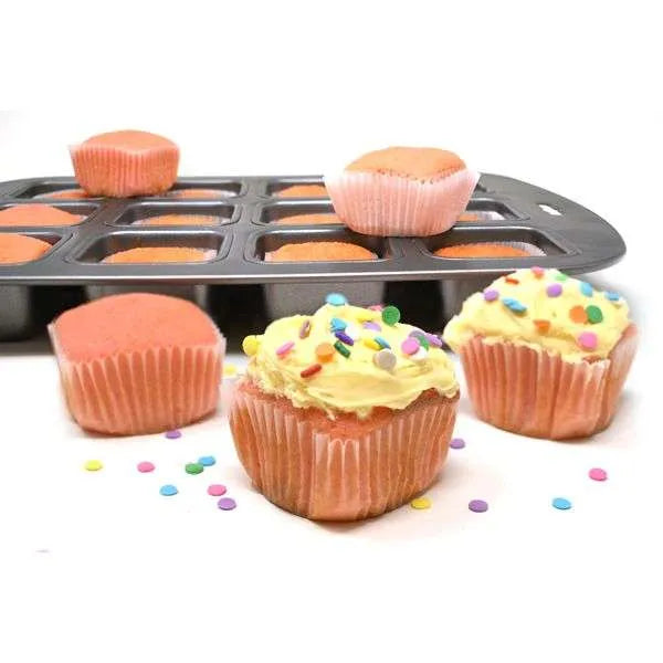 Square baking pan filled with pink cupcakes, some topped with yellow frosting and colorful confetti sprinkles.