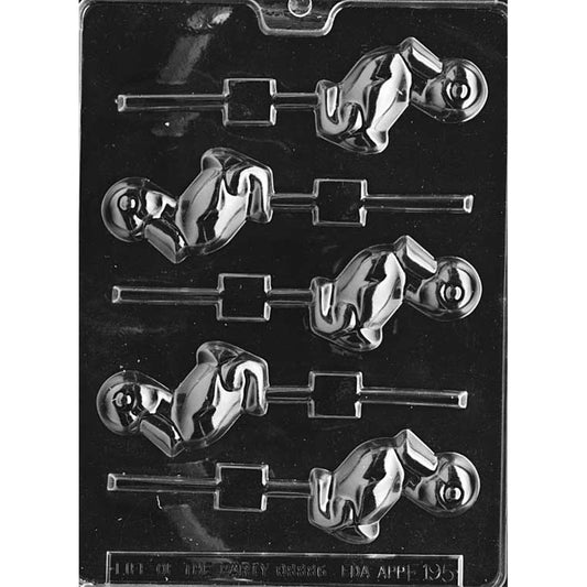Clear plastic chocolate lollipop mold with six duckling-shaped cavities showing a sitting duck with a raised eye and curved bill, each cavity aligned with a lollipop stick channel on a dark background.