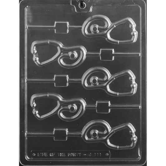 Clear plastic stethoscope chocolate lollipop mold with five stethoscope-shaped cavities showing curved tubing and chest piece details, each with a stick channel, on a dark background.