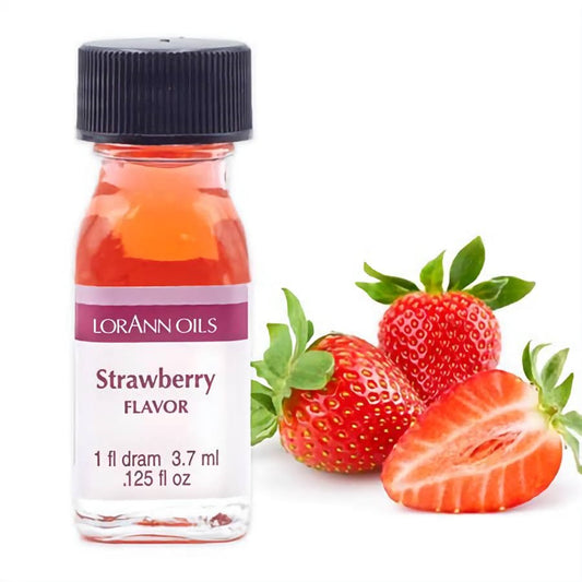 LorAnn Oils Strawberry Flavor 1-dram bottle with a black cap beside whole and sliced strawberries on a white background.