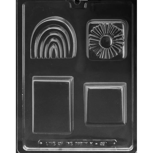 Clear chocolate mold with four assorted cavities featuring a rainbow, square sunburst design, plain rectangle, and plain square.
