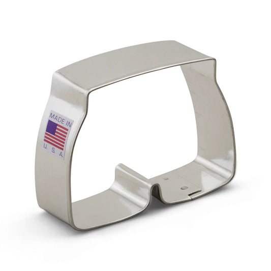 Metal swim trunks-shaped cookie cutter with a Made in USA label, displayed against a white background.