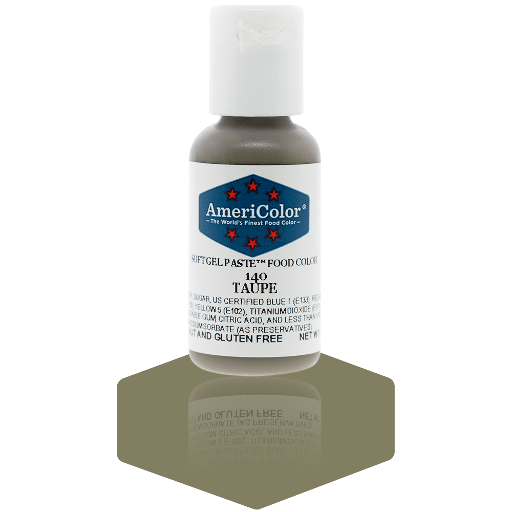 A bottle of AmeriColor Taupe soft gel paste food coloring with a white cap, blue label, and red stars, standing on a taupe brown reflective surface that mirrors the bottle.