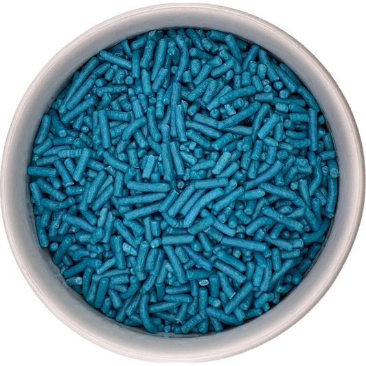 Top-down view of a round container filled with teal jimmies sprinkles, showing densely packed rod-shaped pieces in a blue-green aqua shade.
