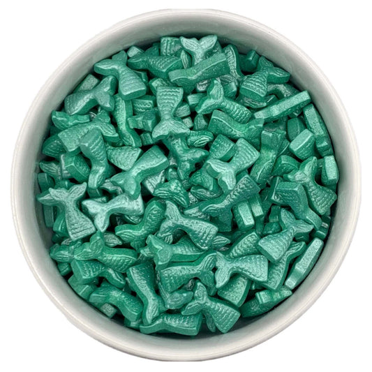 Image of teal mermaid tail sprinkles in a bowl, perfect for decorating mermaid cakes and cupcakes