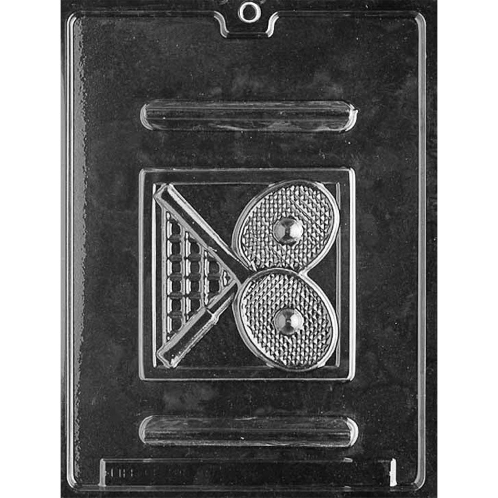 Clear chocolate mold with one square plaque cavity featuring raised tennis racquets, tennis balls, textured racquet strings, and a simple rectangular border on a dark background.