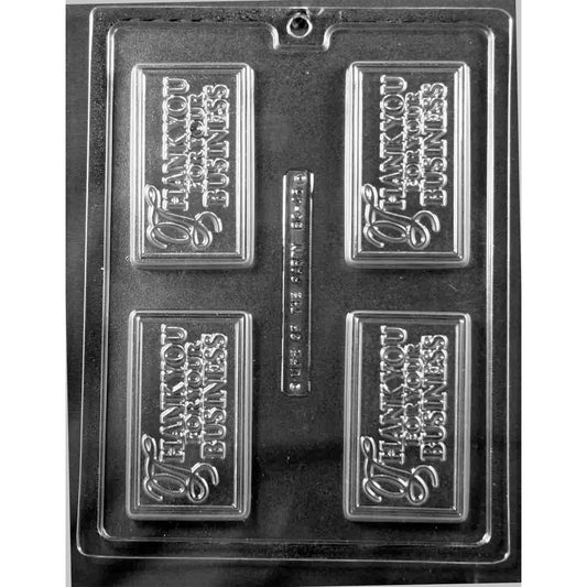 Clear Thank You For Your Business Chocolate Bar Mold photographed against a black background with four rectangular bar cavities featuring raised thank-you lettering.