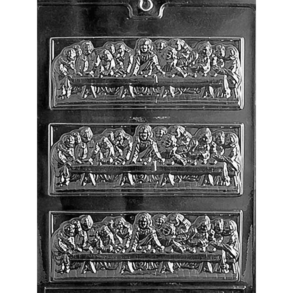 Clear chocolate mold with three rectangular bar cavities featuring the Last Supper scene with Jesus and the disciples seated together at a long table.