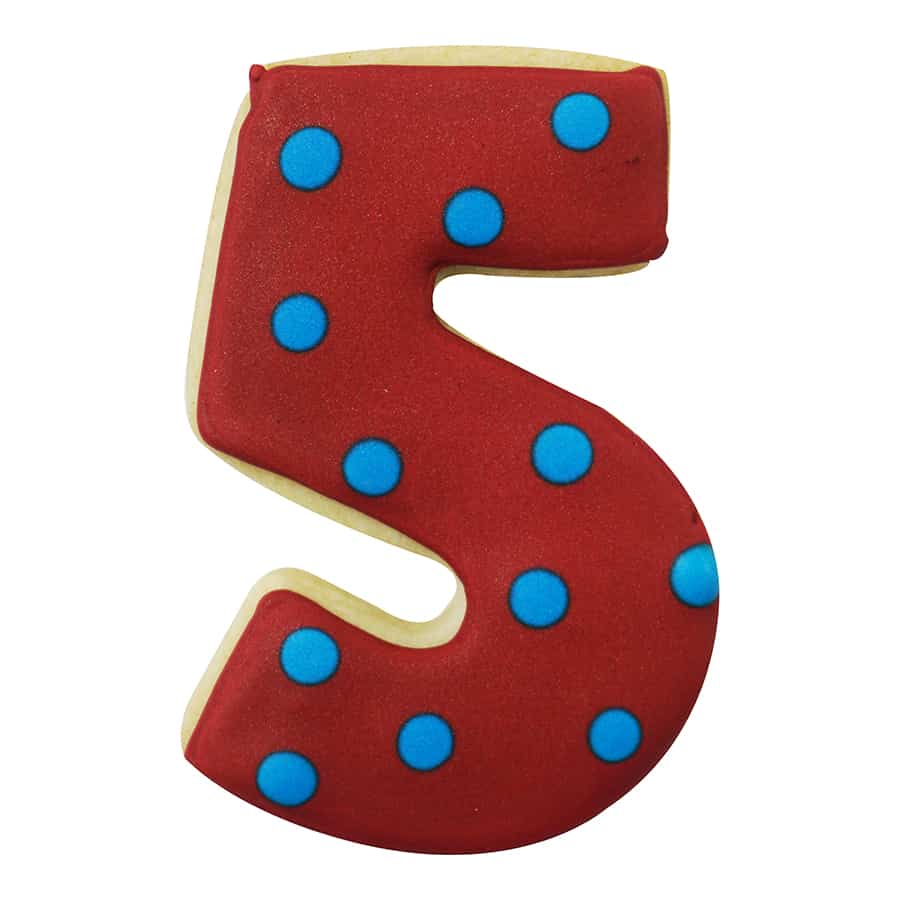 Red Number 5 cookie decorated with blue polka dots for a playful look.