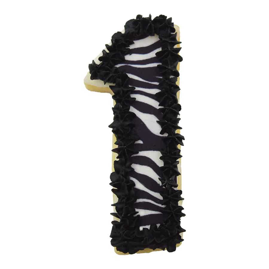 Zebra-patterned Number 1 cookie with black icing trim, perfect for wild-themed celebrations.