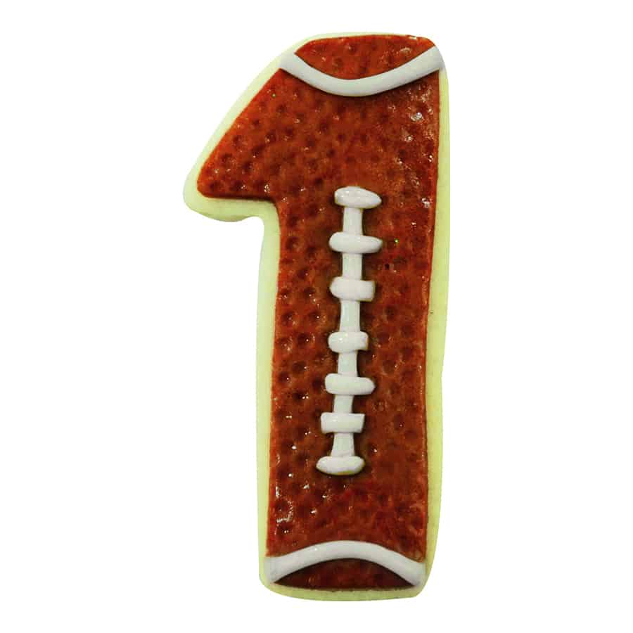 Football-themed Number 1 cookie with brown icing, white laces, and realistic texture.