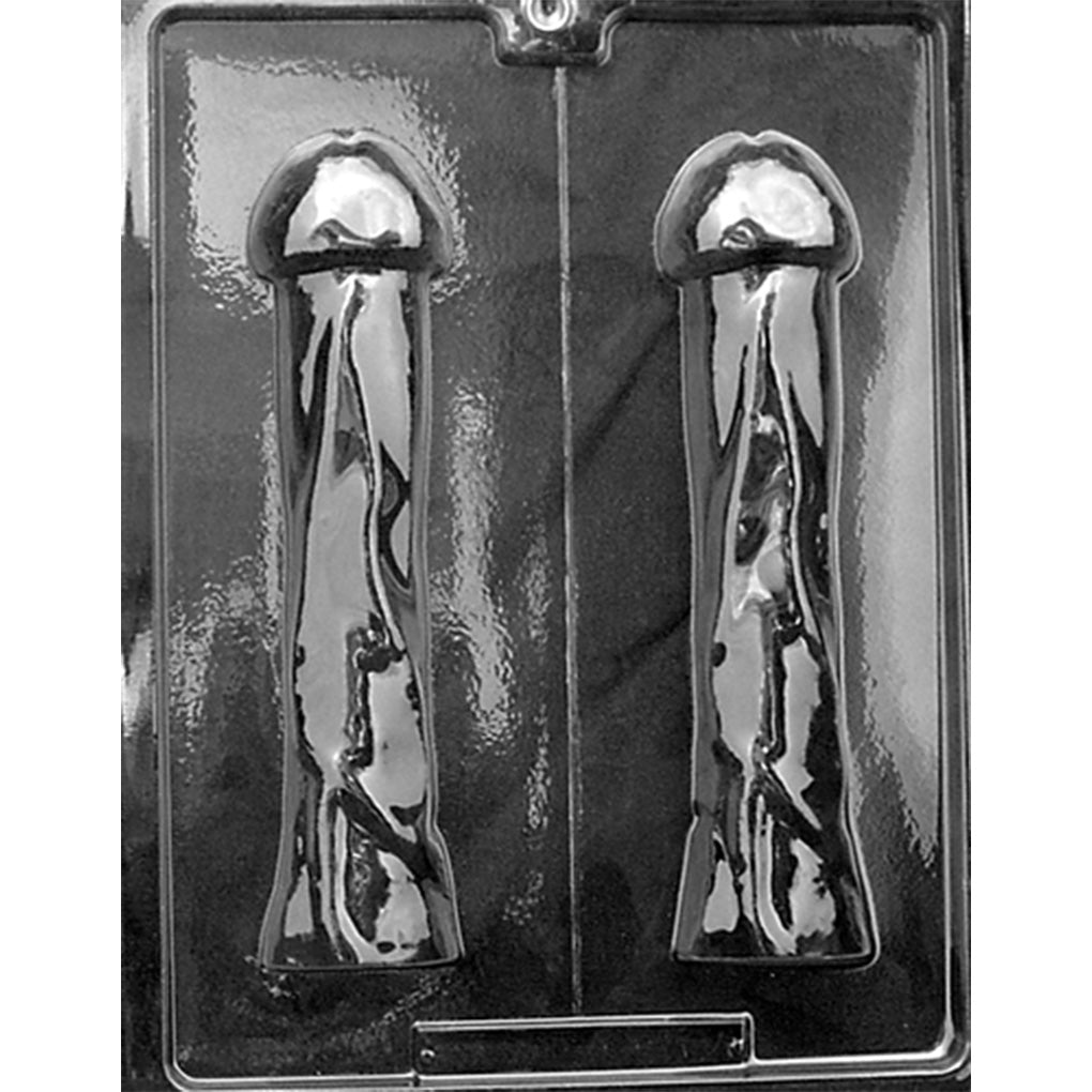 Clear plastic Pleaser 3D Penis Chocolate Mold photographed against a dark background, showing two long matching penis-shaped cavities designed to form the two halves of one complete piece.