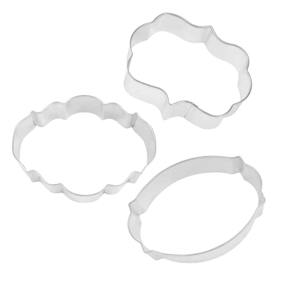 Three metal cookie cutters in various plaque shapes, displayed on a white background.