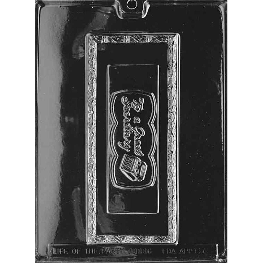 Clear To a Great Secretary Chocolate Bar Mold photographed against a black background with one 8-inch plaque, typewriter, and ornate border