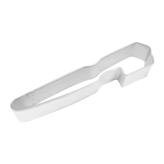 Metal toothbrush-shaped cookie cutter with a long handle and rectangular bristle section, photographed from a top-down view on a white background.