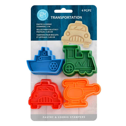 Set of four colorful transportation-themed cookie stampers in blue, green, red, and orange, shaped like a boat, train, car, and helicopter.