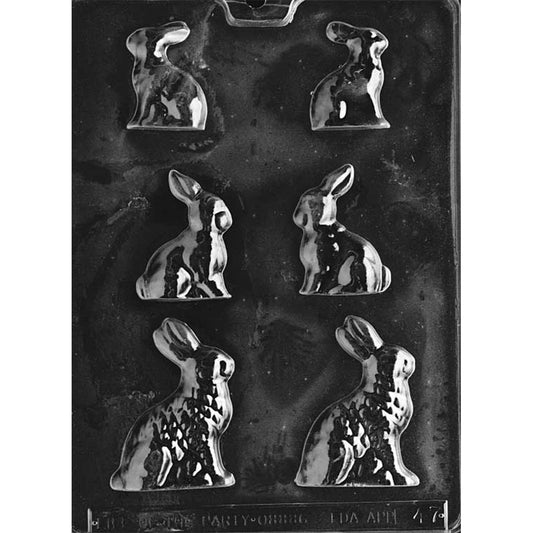 Clear plastic chocolate mold with seated bunny cavities in three different sizes, showing side-profile rabbits arranged in rows on a dark background.