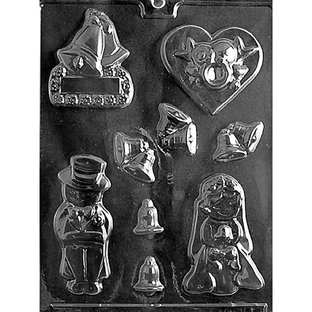 Clear plastic wedding-themed chocolate mold showing cavities for a bride and groom figure, wedding bells, a heart with decorative details, small bells, and a place card shape on a dark background.