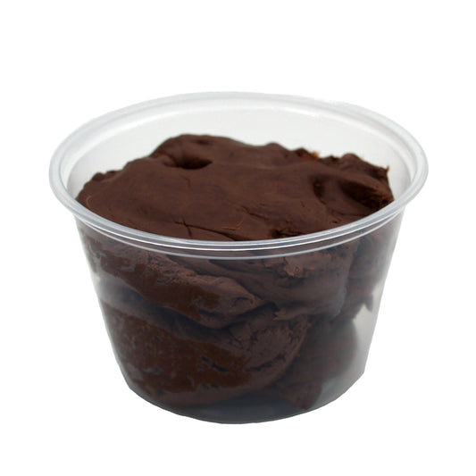 Clear plastic container filled with whipped chocolate candy center mixture.