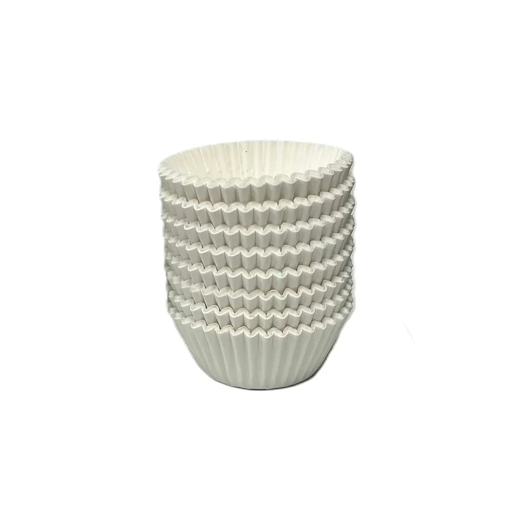 Stack of white paper candy cups with fluted, accordion-fold sides.