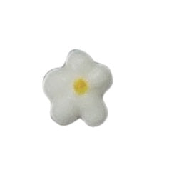 Small white royal icing flower with subtle yellow center