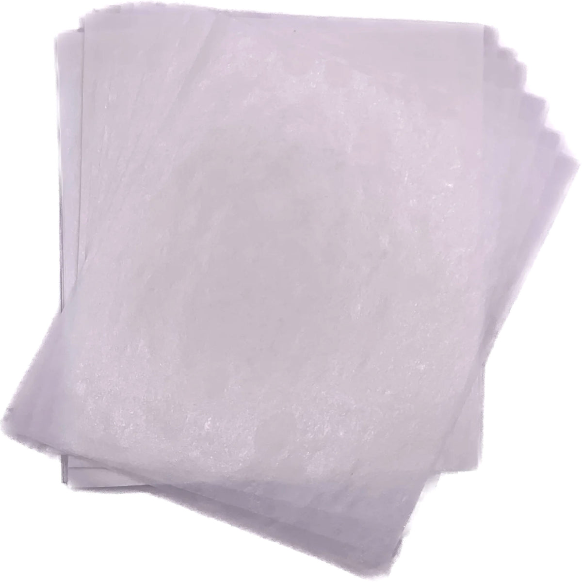 Overlapping stack of lightly translucent white 4" x 5" wax caramel wrappers shown flat against a white background.