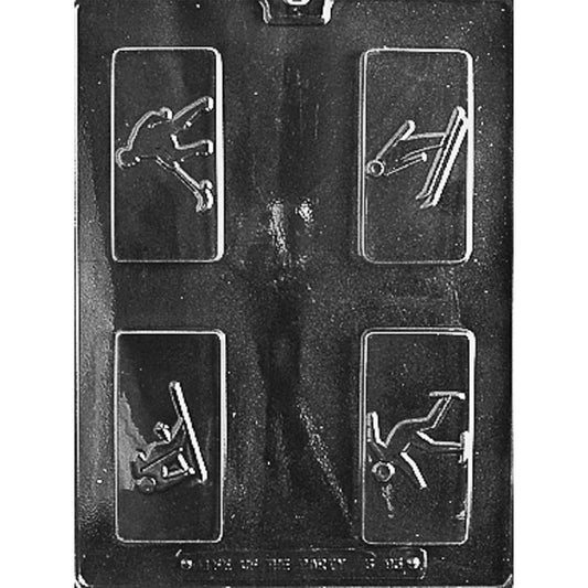 Clear plastic chocolate mold photographed against a black background, with four rectangular bar cavities showing winter athletes in raised action poses, including skating and ski jumping.