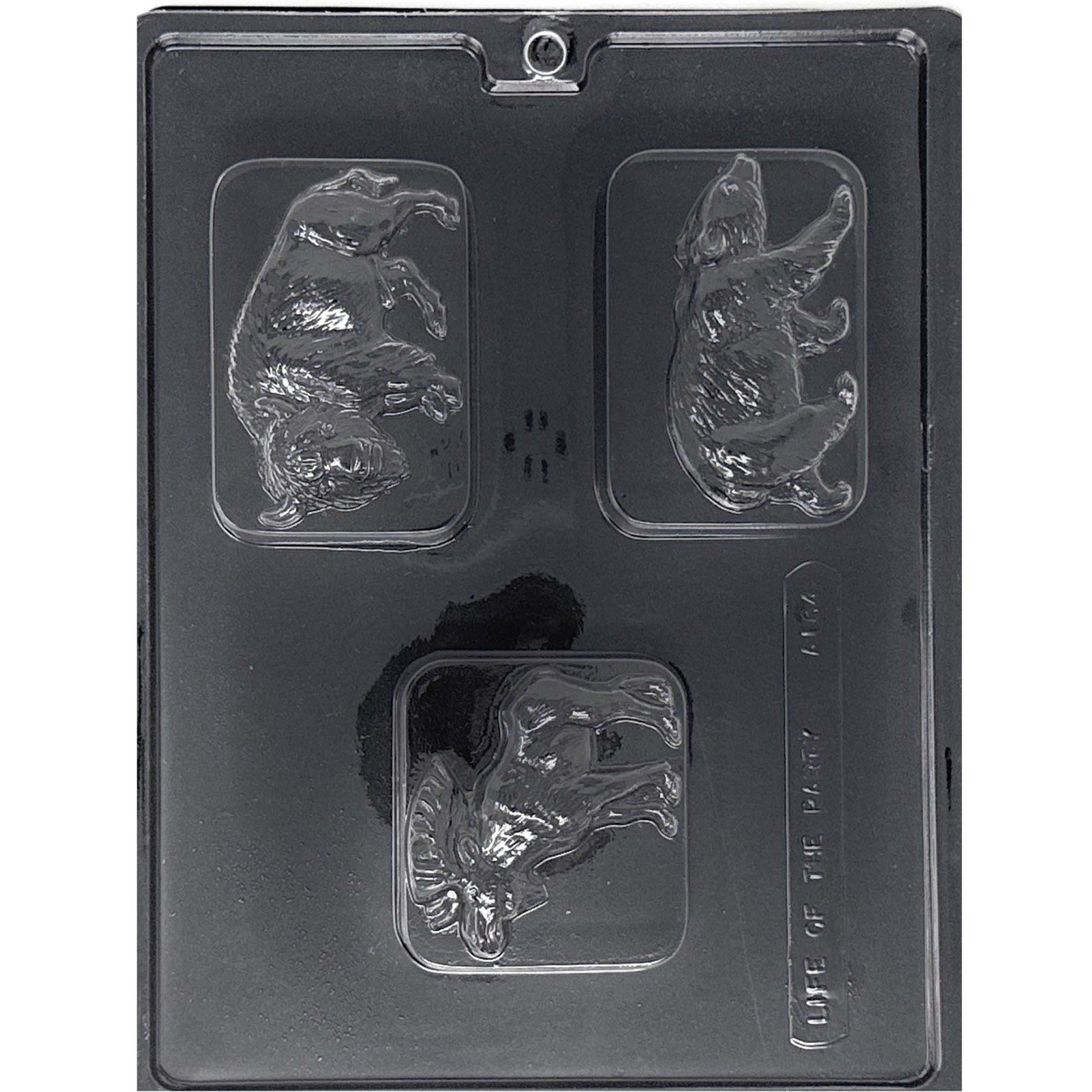 Clear Woodland Animal Chocolate Bar Mold photographed against a black background with three rectangular cavities featuring a bear, bison, and moose.