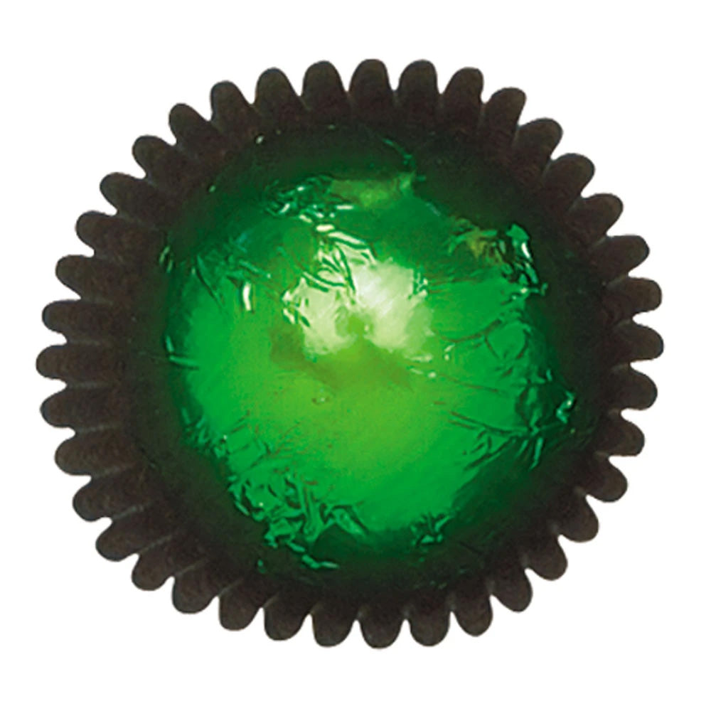 Close-up of a green foil-wrapped chocolate in a dark brown paper candy cup, showing glossy green foil with crinkled texture.