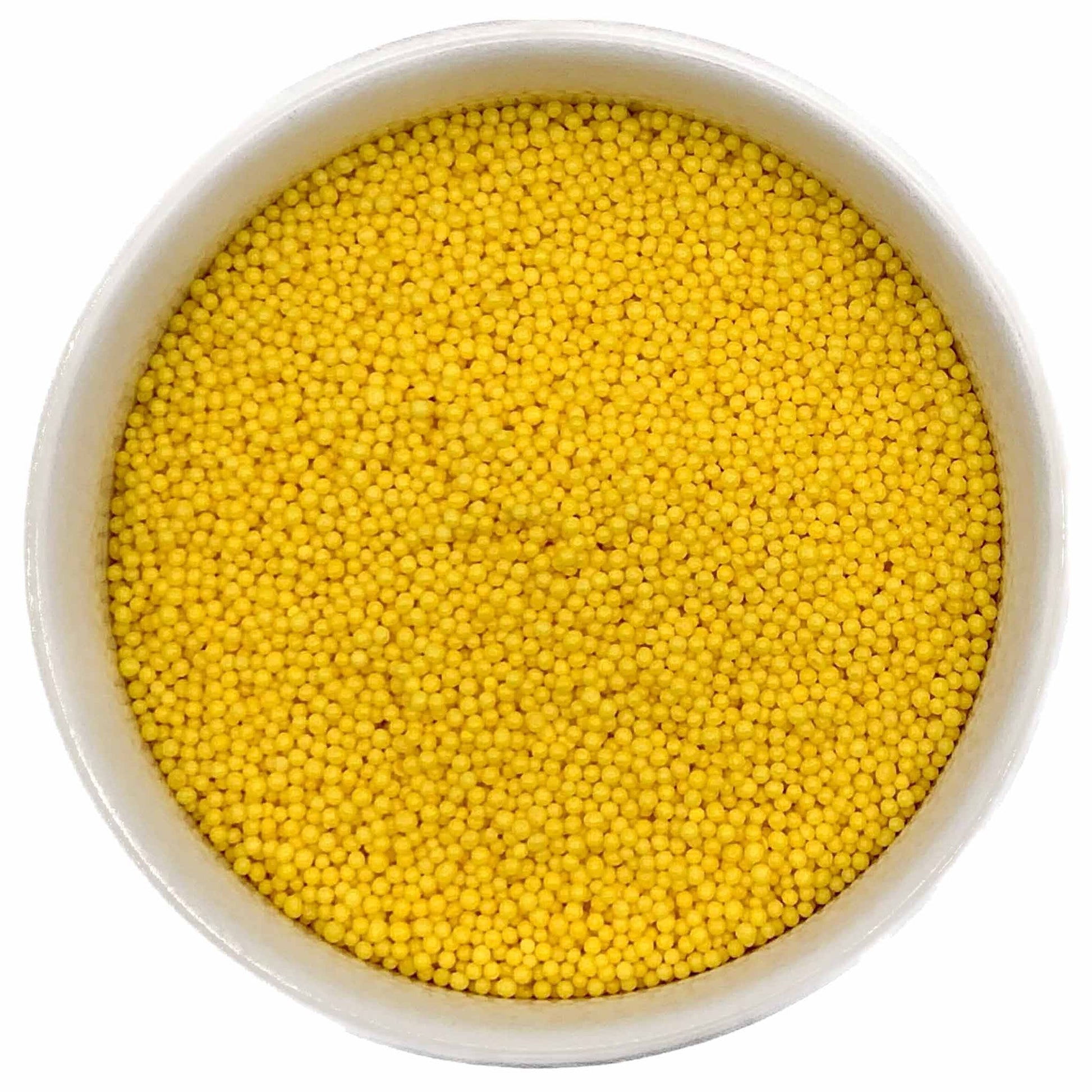 Bowl filled with bright yellow nonpareil sprinkles on a white background.