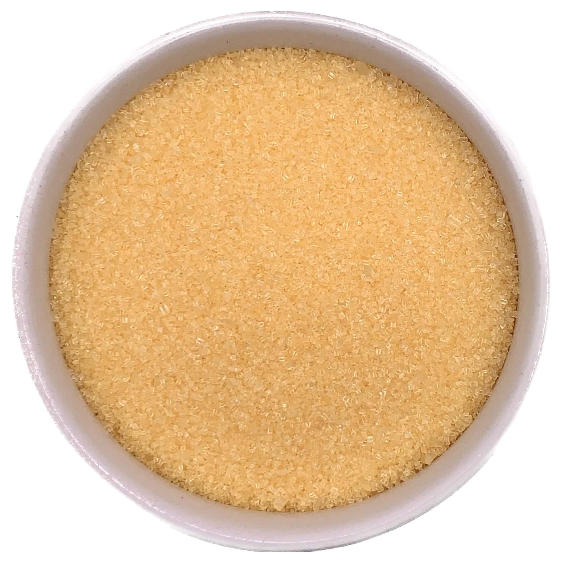 Top-down view of a white bowl filled with yellow fine sanding sugar, showing tiny golden-yellow crystals with a soft, shimmering texture.