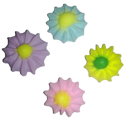 An image featuring five royal icing leaves in varying shades of purple, blue, yellow, and pink, each centered with a yellow or green hue. These sugarpaste decorations offer a lovely complement to floral cake designs, adding a touch of natural elegance.