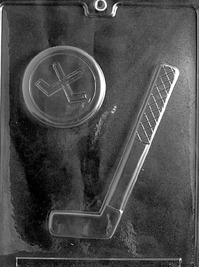 Clear plastic chocolate mold with two cavities: a long hockey stick with taped grip texture and angled blade, and a round puck with raised rim and simple emblem; sports-themed mold sized about 6.5 x 2.25 x 7/16 in for the stick and 2.75 in round by 0.5 in deep for the puck.