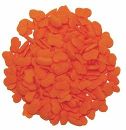 Pile of bright orange pumpkin-shaped quin sprinkles with small rounded pumpkin silhouettes, shown against a white background.
