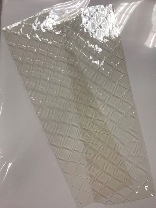 A sheet of clear gelatine, likely silver leaf gelatine, placed on a white surface.
