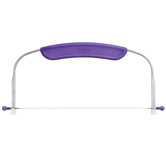 Wilton small cake leveler with a purple ergonomic handle, metal frame, and adjustable thin wire blade stretched across; numbered side guides, 12 x 6.25 in tool for leveling and torting cakes up to 10 inches wide.