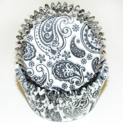 Stack of black and white paisley standard baking cups with 2-inch base and 1-1/4-inch wall, ideal for stylish cupcake presentations.