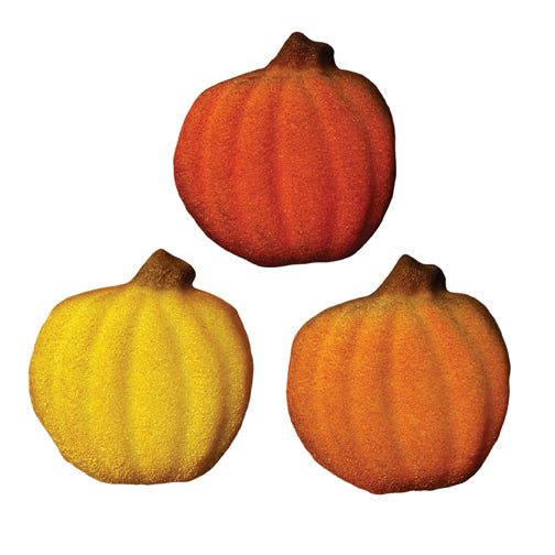 Three shimmering pressed sugar pumpkins in red, orange, and yellow with subtle sparkle and ridged detailing.