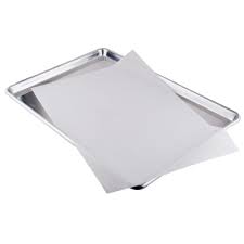Rolled full sheet parchment paper pack on baking tray, each sheet measuring 16 3/8" x 24 3/8", ideal for commercial baking and prep work