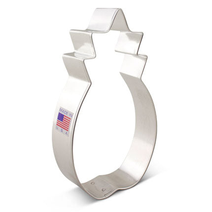 Large pineapple-shaped metal cookie cutter, 5 1/8" tall, with "Made in USA" label on side.