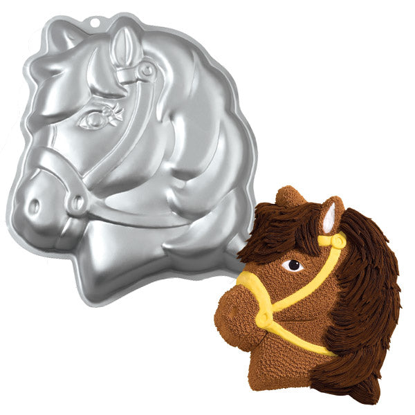 Aluminum pony-shaped cake pan with detailed facial features, shown next to a decorated cake resembling a brown pony with a yellow bridle and piped mane