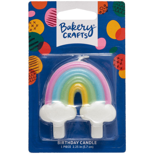 Rainbow-shaped birthday candle with clouds on both ends, displayed in Bakery Crafts packaging, measuring approximately 2.1 x 2.7 inches.