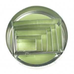 A set of 6 rectangular cookie cutters nested within each other in a storage tin. 