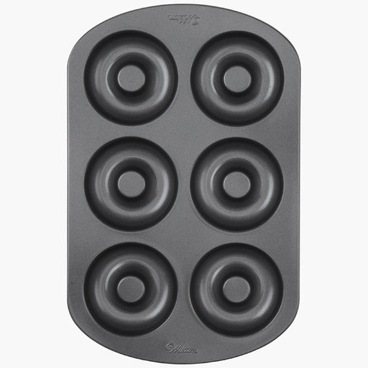 Six-cavity nonstick donut pan designed for baking full-size donuts at home.
