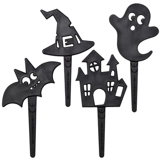 Four black Halloween cupcake picks shaped like a bat, witch hat, haunted house, and ghost with playful facial features.